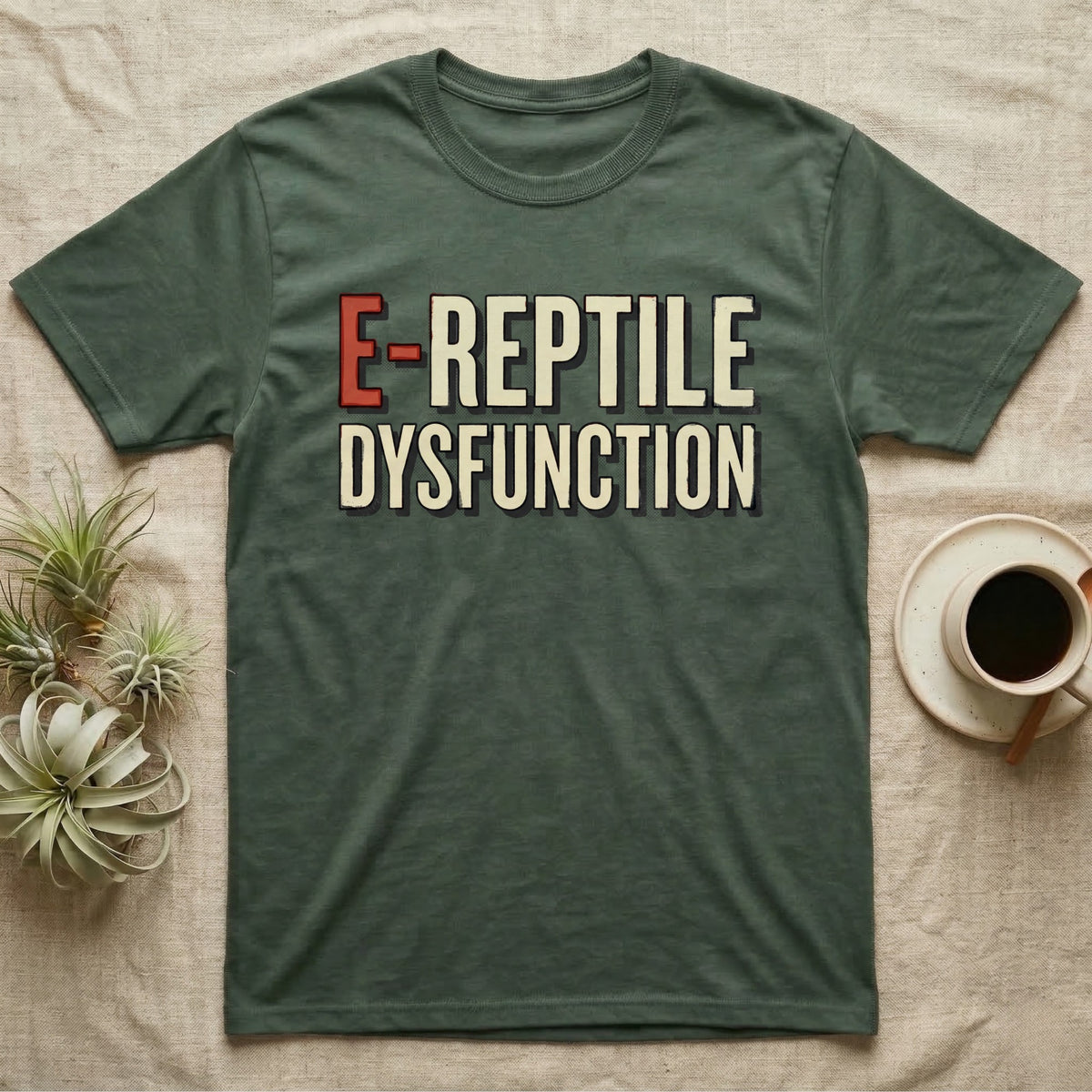 E-Reptile Dysfunction Gecko T-Shirt in Military Green — Retro-pharmacy typographic wordmark reading "E-Reptile Dysfunction" in distressed cream and tomato-red lettering.