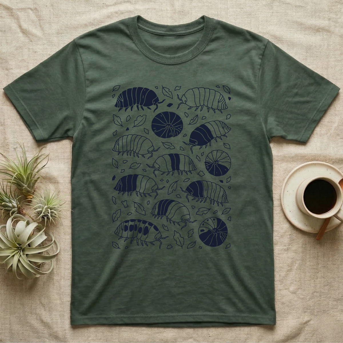 Cubaris Isopod Morph Collection T-Shirt in Military Green — Deep navy single-ink illustration of Cubaris isopods in varied morph patterns scattered across leaf litter.