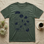 Cubaris Isopod Morph Collection T-Shirt in Military Green — Deep navy single-ink illustration of Cubaris isopods in varied morph patterns scattered across leaf litter.