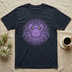 Vampire Crab Folk Medallion T-Shirt in Navy — Violet woodblock vampire crab seen face-on, its raised claws cut into a contained folk sunburst medallion.