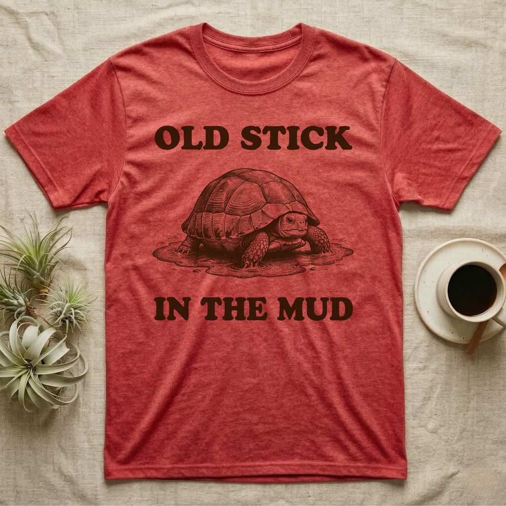 Hermann's Tortoise Mud T-Shirt in Heather Red — Engraved Hermann's tortoise sitting in a mud puddle, with the words Old Stick in the Mud
