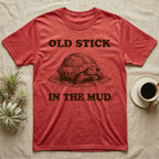 Hermann's Tortoise Mud T-Shirt in Heather Red — Engraved Hermann's tortoise sitting in a mud puddle, with the words Old Stick in the Mud