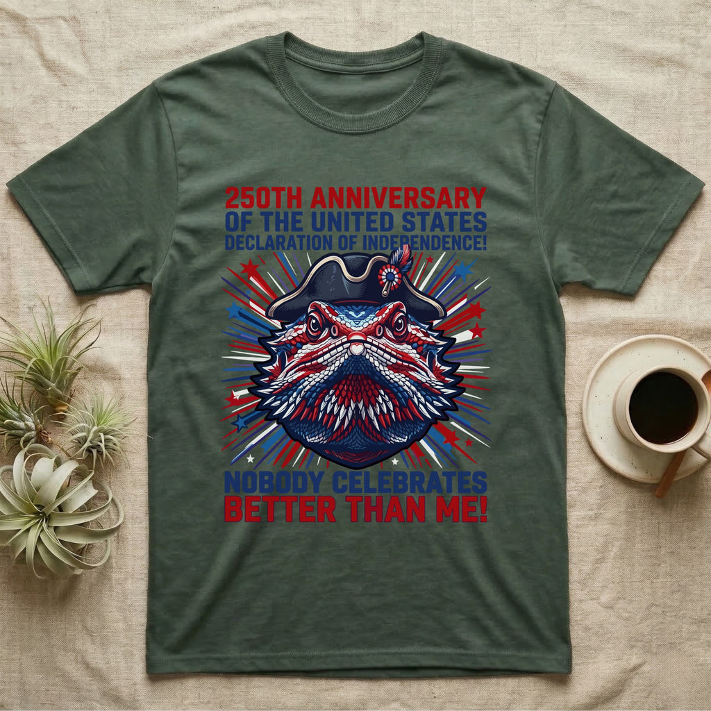 Bearded Dragon Fireworks T-Shirt in Military Green — Pop-art bearded dragon head in a tricorn hat amid red-white-blue fireworks under Nobody Celebrates Better Than Me.