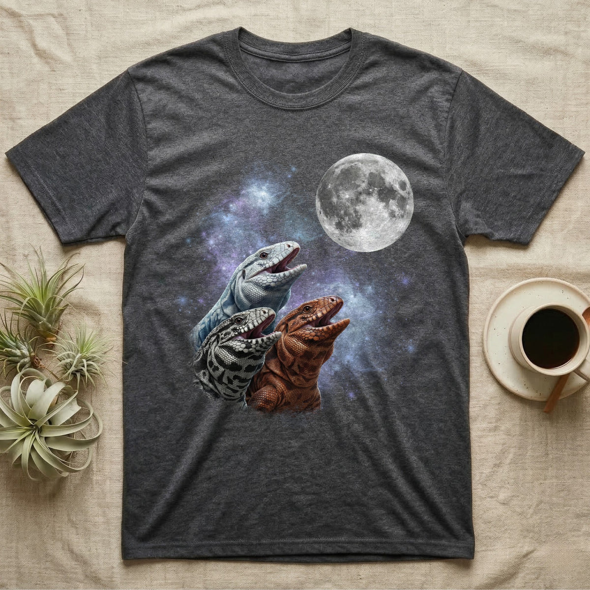 Tegu Moon Howl T-Shirt in Dark Heather — Three Tegu colour morphs howling at a full moon over a nebula on a dark grey t-shirt.