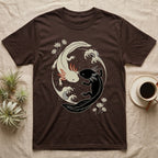 Axolotl Yin-Yang T-Shirt in Dark Chocolate — Japanese woodblock style print of a cream axolotl with red gills and a black axolotl curled nose to nose into a circle with waves and water lilies