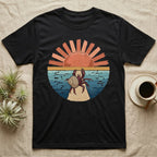 Hermit Crab Big Stretch T-Shirt in Black — Palette-knife painted medallion of a Caribbean hermit crab at full stretch under a coral sunburst.