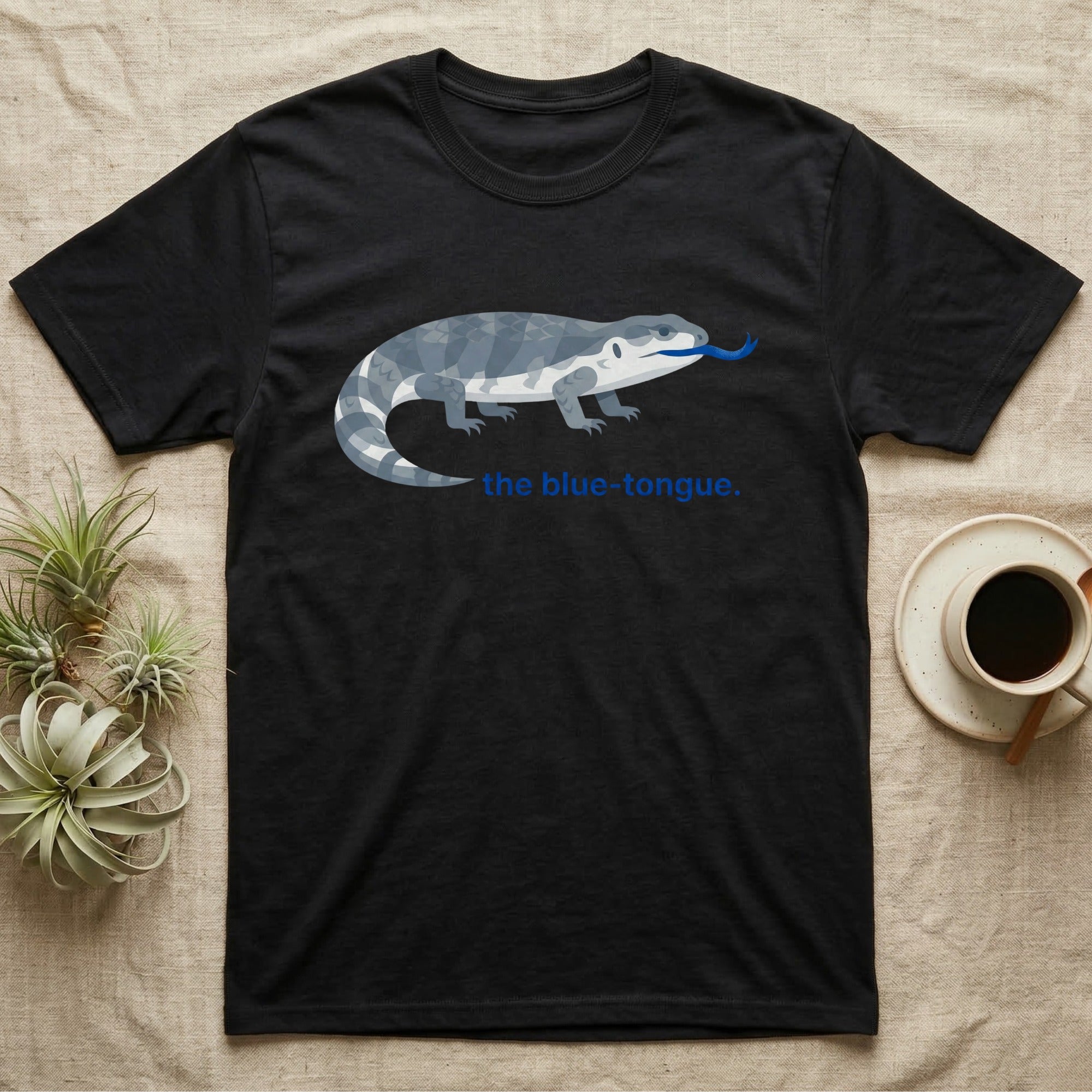 Black t-shirt with blue-tongue lizard graphic and text "the blue-tongue".