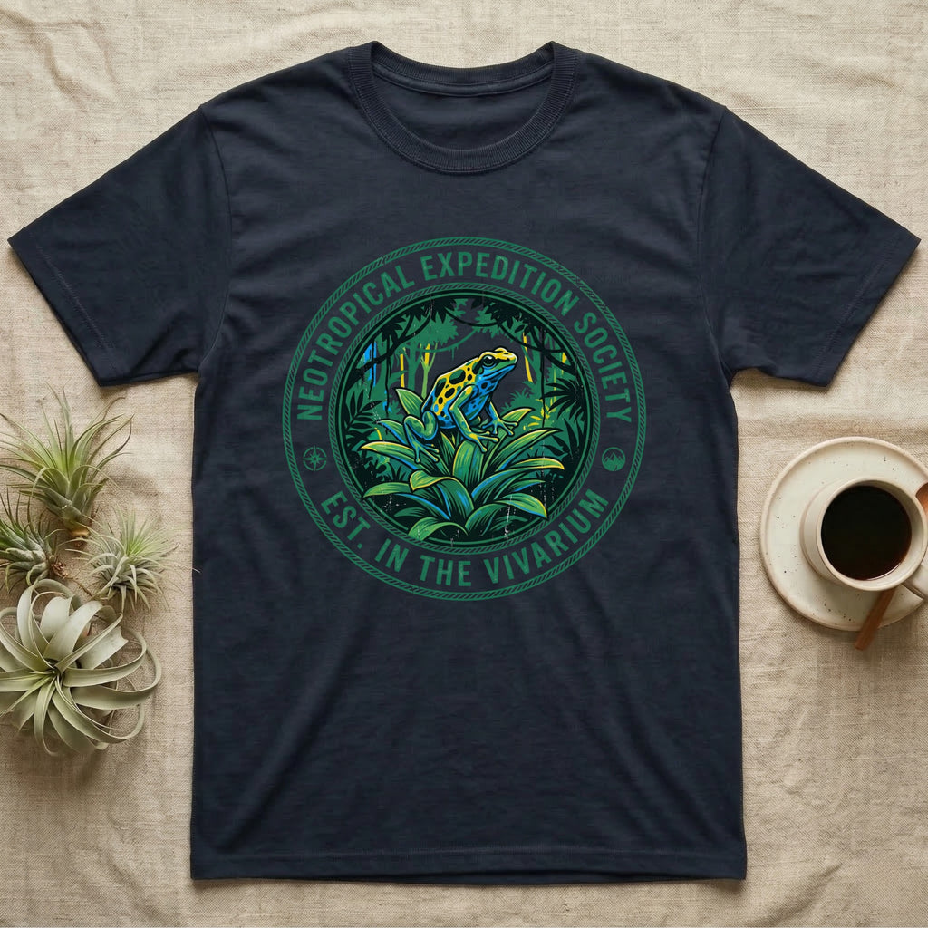 Dark t-shirt with green circle logo featuring a frog in a tropical environment.