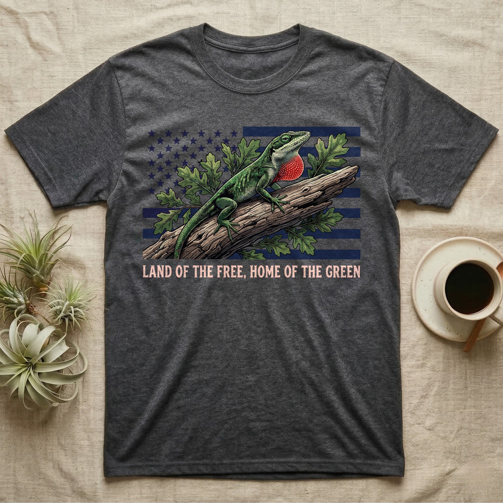 Green Anole 1776 T-Shirt in Dark Heather — Realistic green anole with a red dewlap on a branch over a distressed flag under text Land of the Free, Home of the Green.