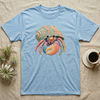 Light blue t-shirt featuring a colorful cartoon hermit crab.