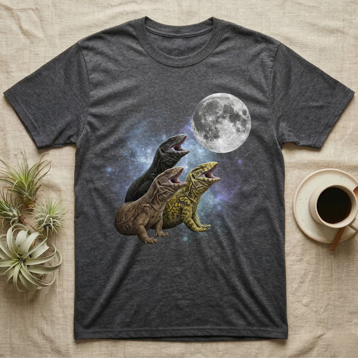 Savannah Monitor Moon Howl T-Shirt in Dark Heather — Three Savannah Monitor colour morphs howling at a full moon over a nebula on a dark grey t-shirt.