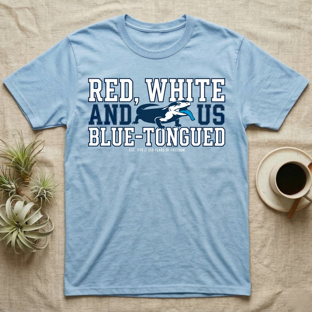 Blue-Tongued Skink 1776 T-Shirt in Light Blue — Navy and white blue-tongued skink with tongue out between collegiate text reading Red, White and US Blue-Tongued.