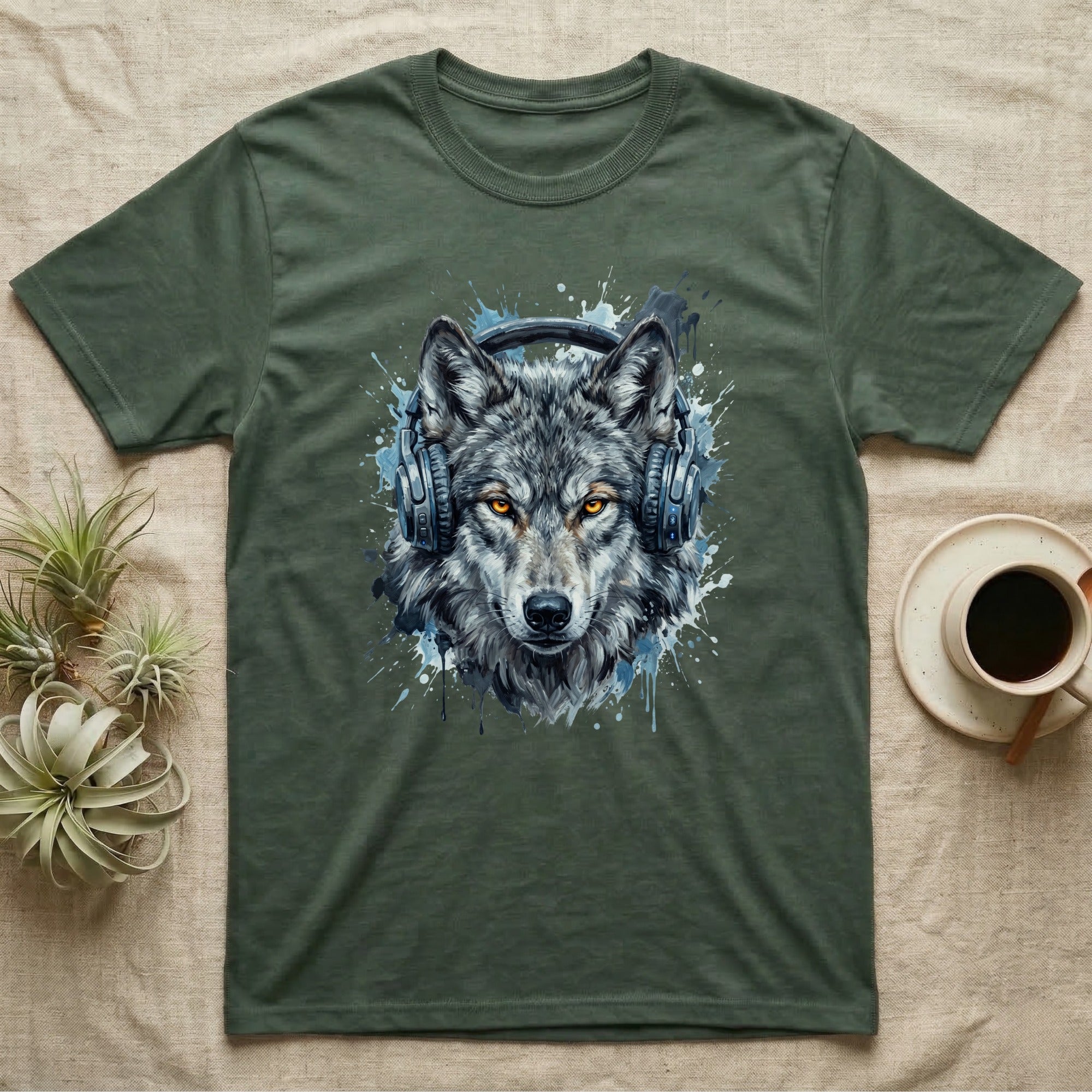 Green t-shirt with a watercolor wolf wearing headphones graphic.