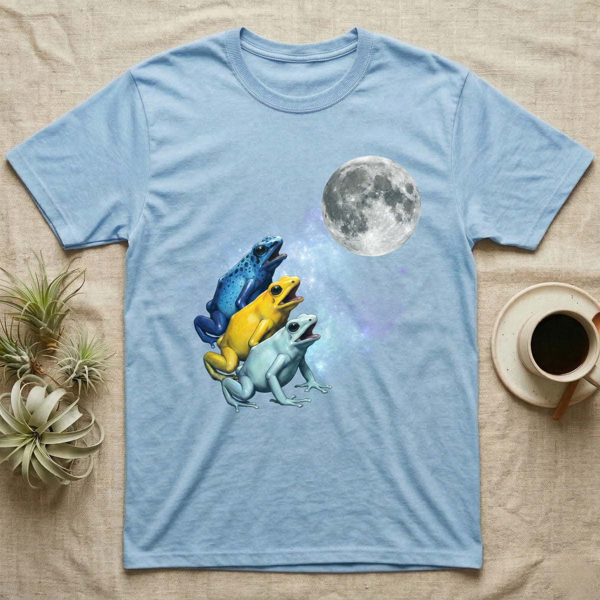 Poison Dart Frog Moon Howl T-Shirt in Light Blue — Three Poison Dart Frog colour morphs howling at a full moon over a nebula on a dark grey t-shirt.