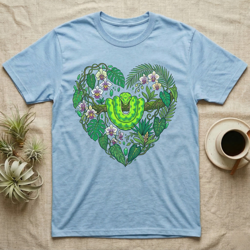 Light blue t-shirt with a green snake and tropical plants forming a heart.