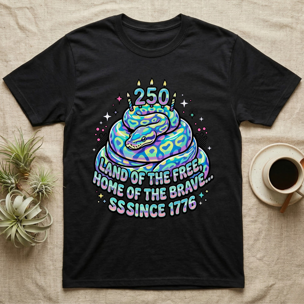 Ball Python Birthday Cake T-Shirt in Black — Y2K pastel ball python coiled as a birthday cake with 250 candles and bubble text Land of the Free, Sssince 1776.