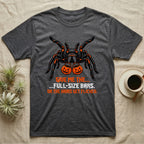 Tarantula Full-Size Bars T-Shirt in Dark Heather — Black-and-orange tarantula holding two jack-o'-lantern buckets, "Give Me the Full-Size Bars Or the Hairs Get Flicked."