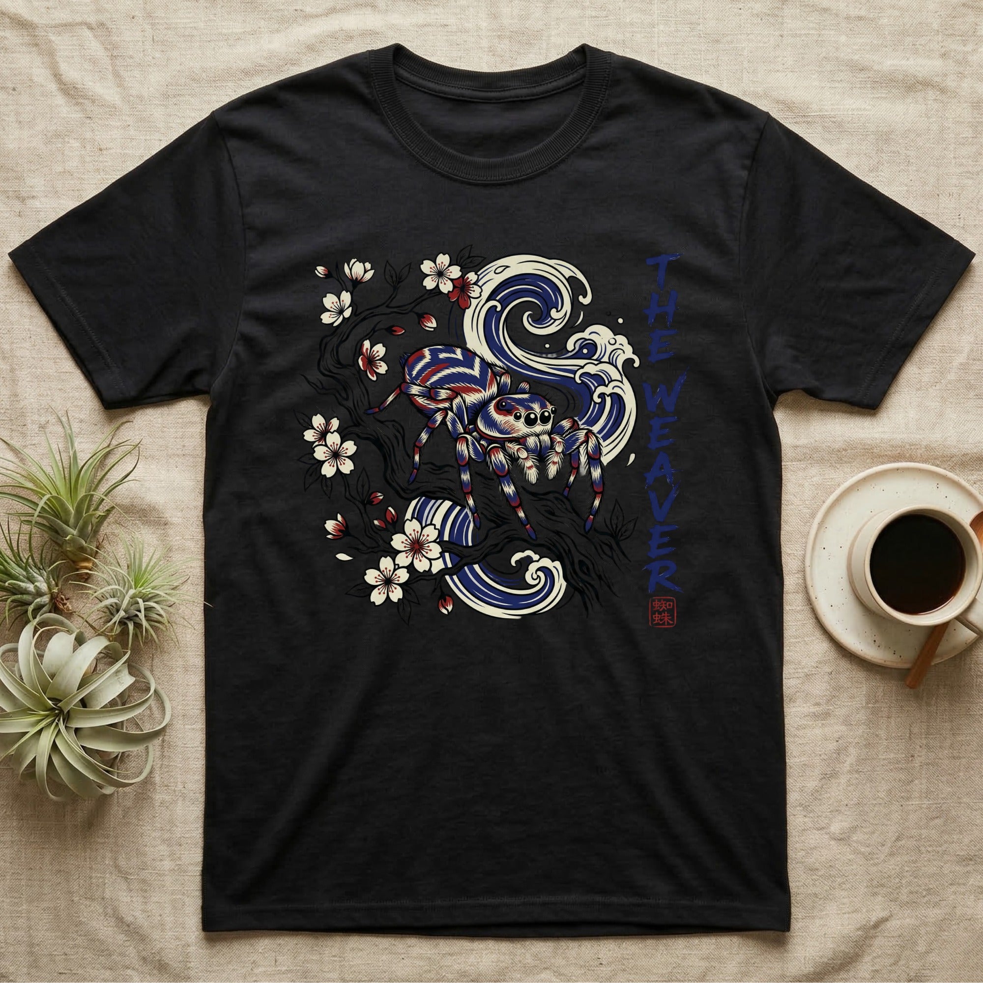 Black t-shirt with spider and wave design, "The Weaver" text.