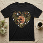 Black t-shirt with a heart-shaped design of a crested gecko and foliage.