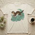 Ferret jumping through stylized green waves, printed on a cream t-shirt.
