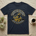Bearded Dragon 1776 T-Shirt in Navy — Bold woodcut tee of a bearded dragon in a tricorn hat black-bearding on a rock, gold and cream banner reading the lizards run the economy.