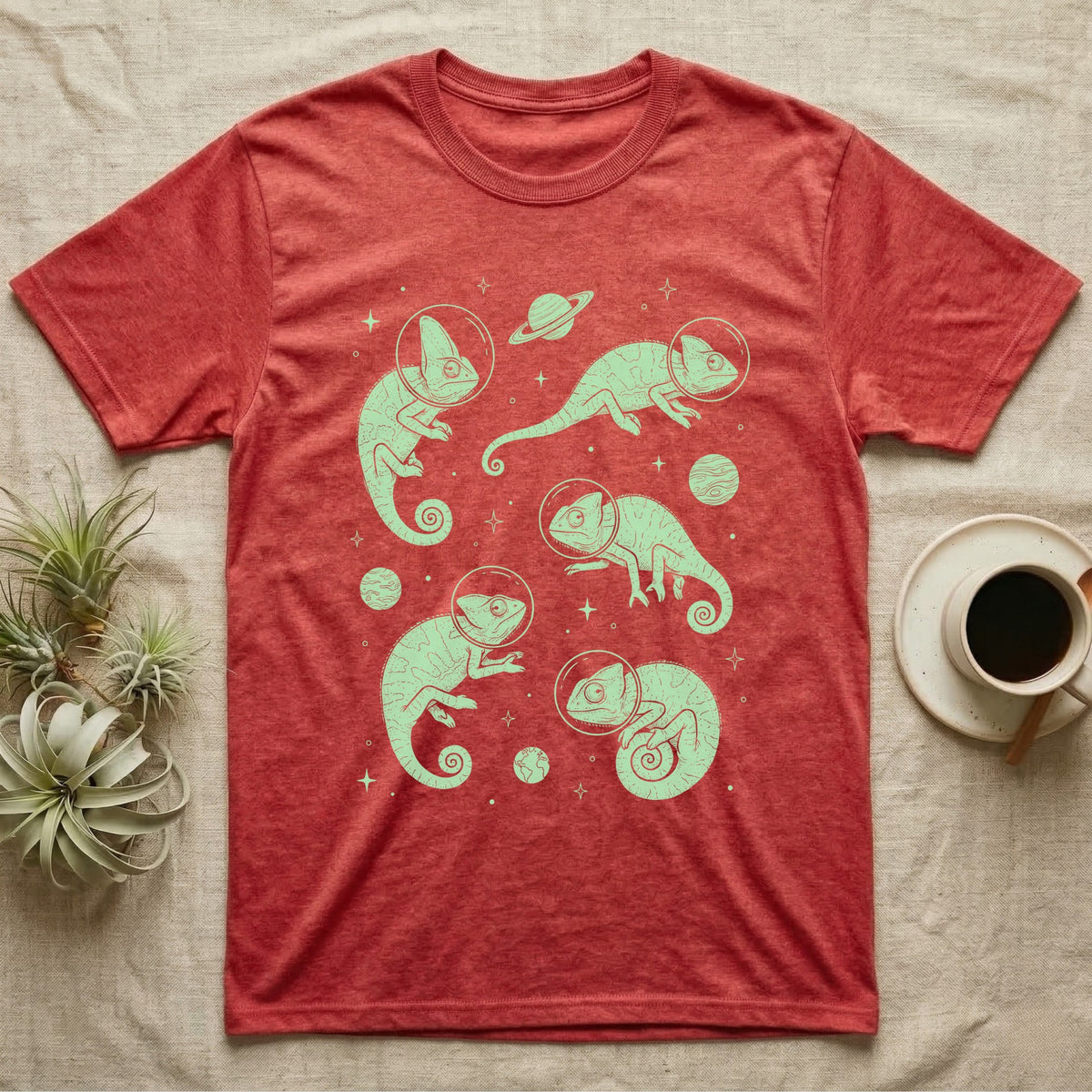 Veiled Chameleon Cosmic T-Shirt in Heather Red — Vintage screen-print illustration of veiled chameleons in astronaut helmets floating in space, cosmic nebula mint green monochromatic on dark background.
