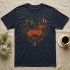 Dachshund on a dark blue t-shirt with a heart-shaped floral and mushroom design.