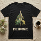 Deadpan photographic mugshot of a veiled chameleon facing the camera beneath its tall casque with the distressed text I See You Twice. — shown on a Black tee.
