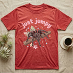 Pink Toe Tarantula Softie T-Shirt in Heather Red — Pink toe tarantula poised to leap on a branch under a puffy pastel "just jumpy" bubble wordmark with tiny hearts.