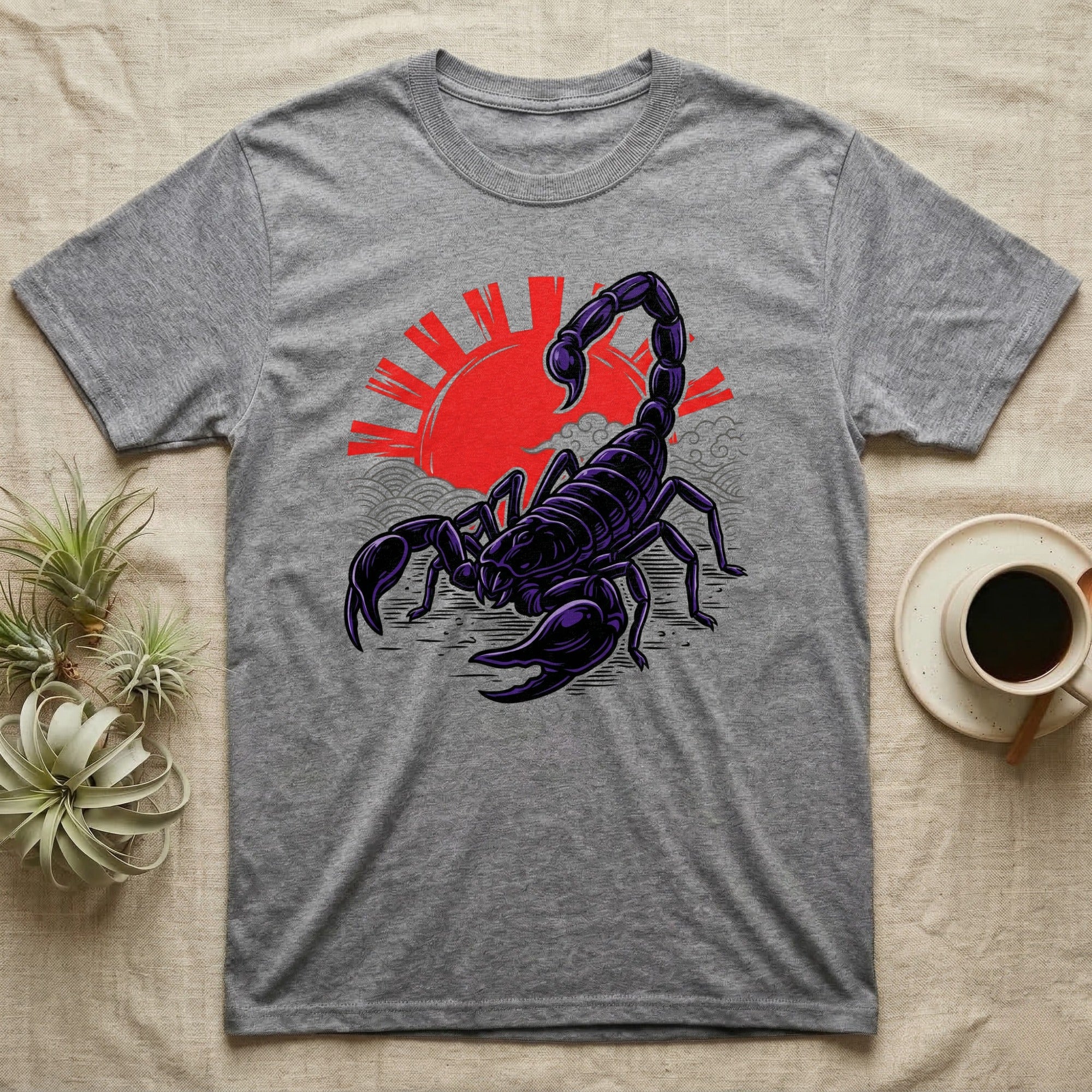 Grey t-shirt with a stylized purple scorpion and red sun design.