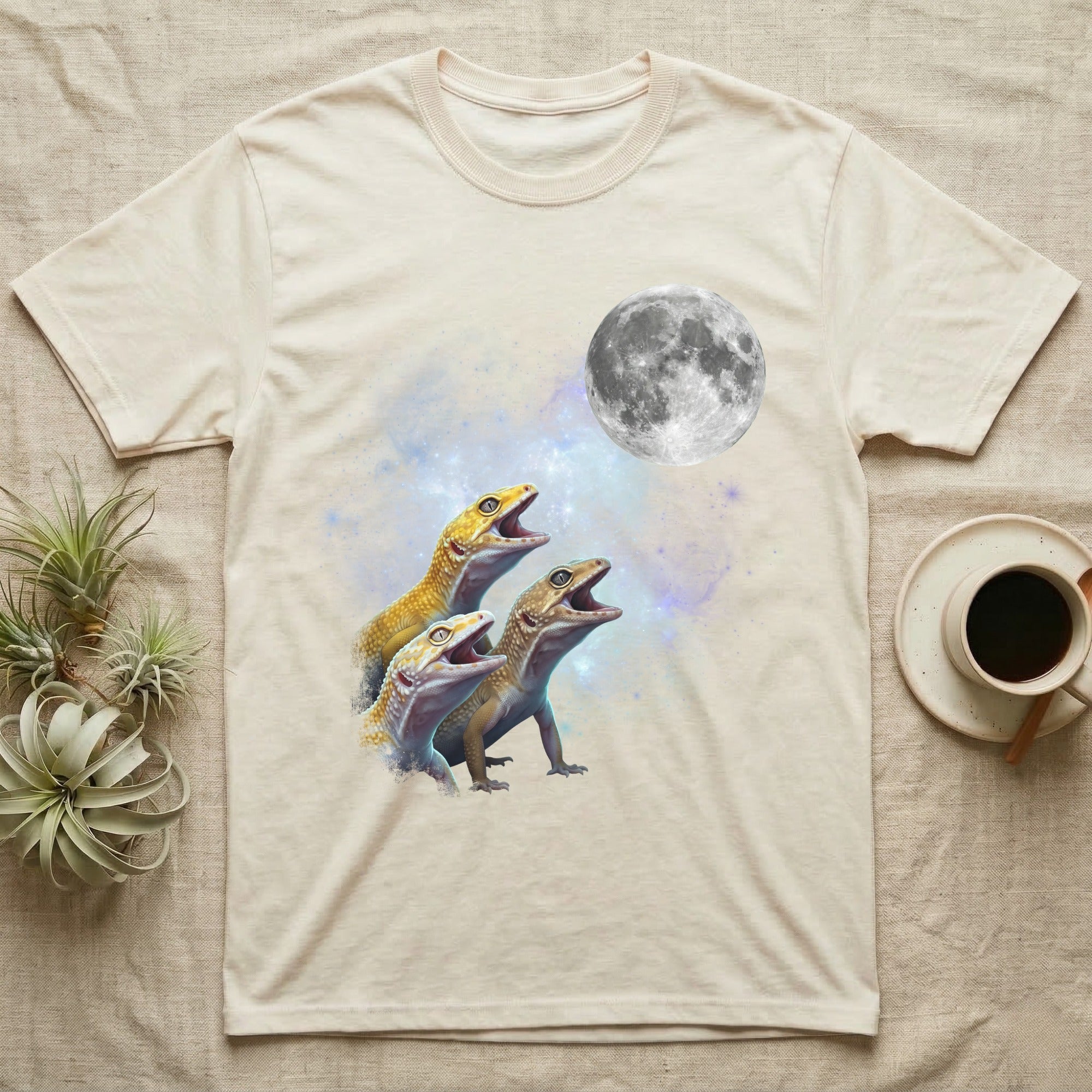 Leopard Gecko Moon Howl T-Shirt in Natural — Three Leopard Gecko colour morphs howling at a full moon over a nebula on a dark grey t-shirt.