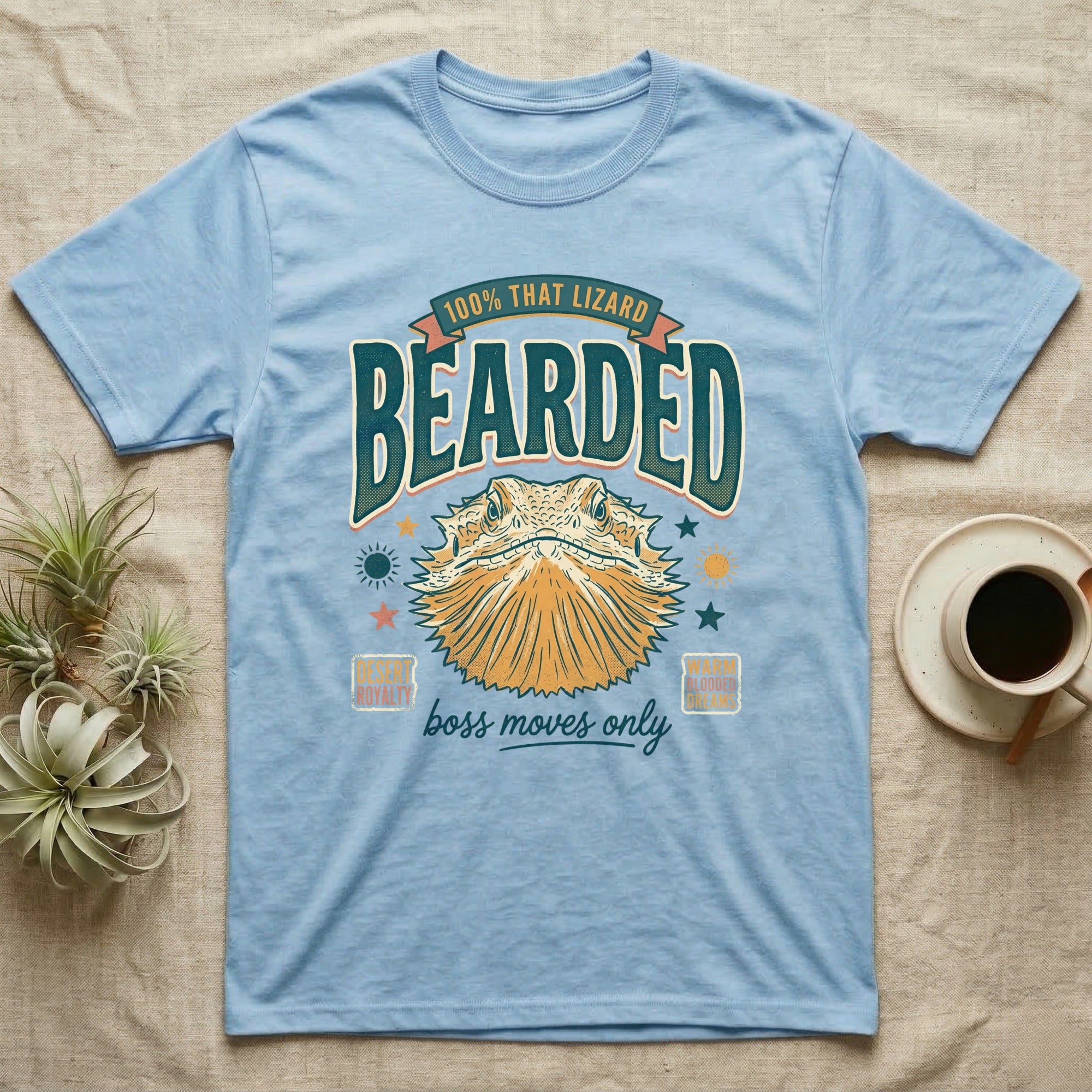 Light blue t-shirt with a bearded dragon graphic and text.