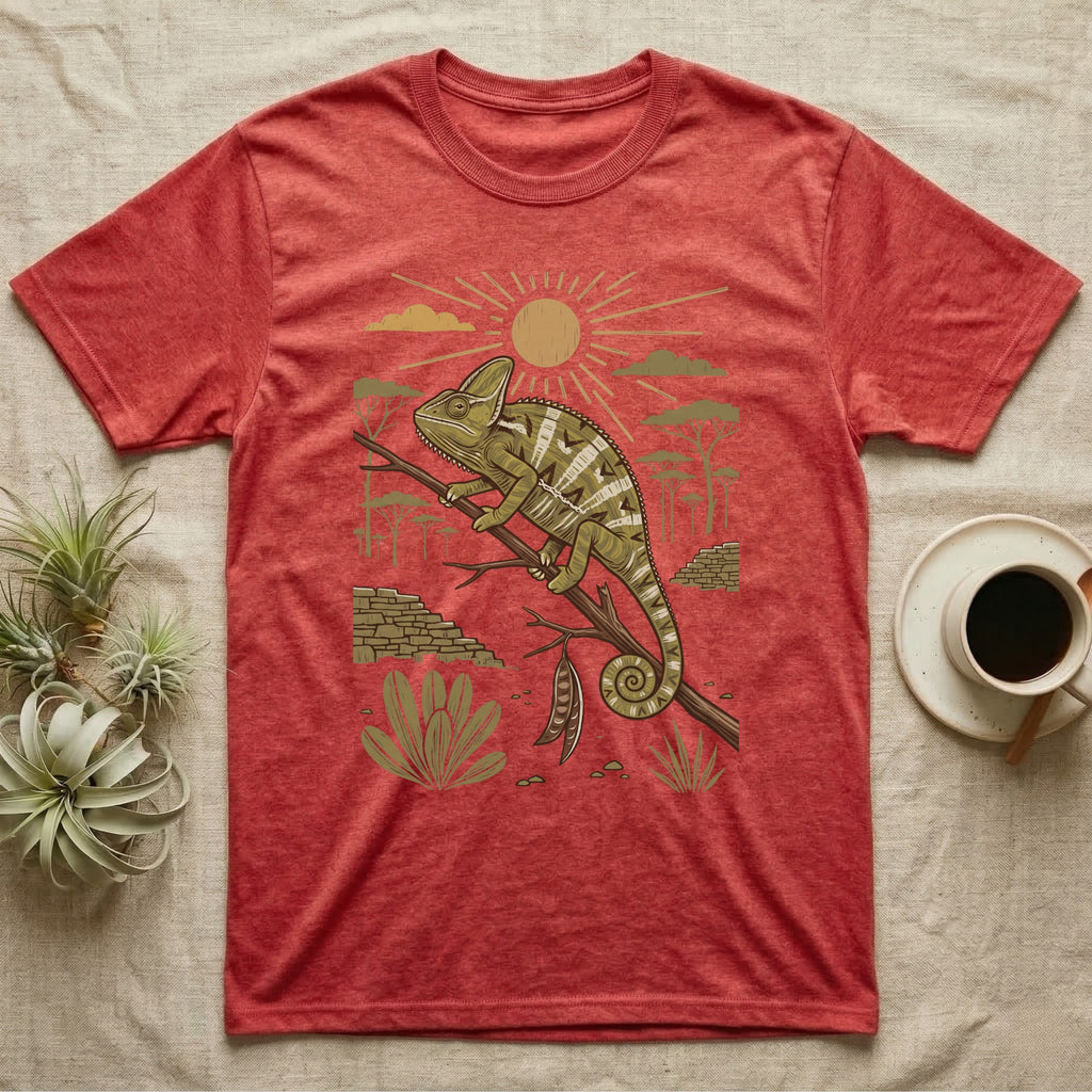 Veiled Chameleon Home Range T-Shirt in Heather Red — Woodcut-style illustration of a veiled chameleon gripping an acacia branch with terraced walls and umbrella trees behind, no on-shirt text.