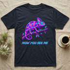 Chameleon with text "NOW YOU SEE ME" on a dark t-shirt.