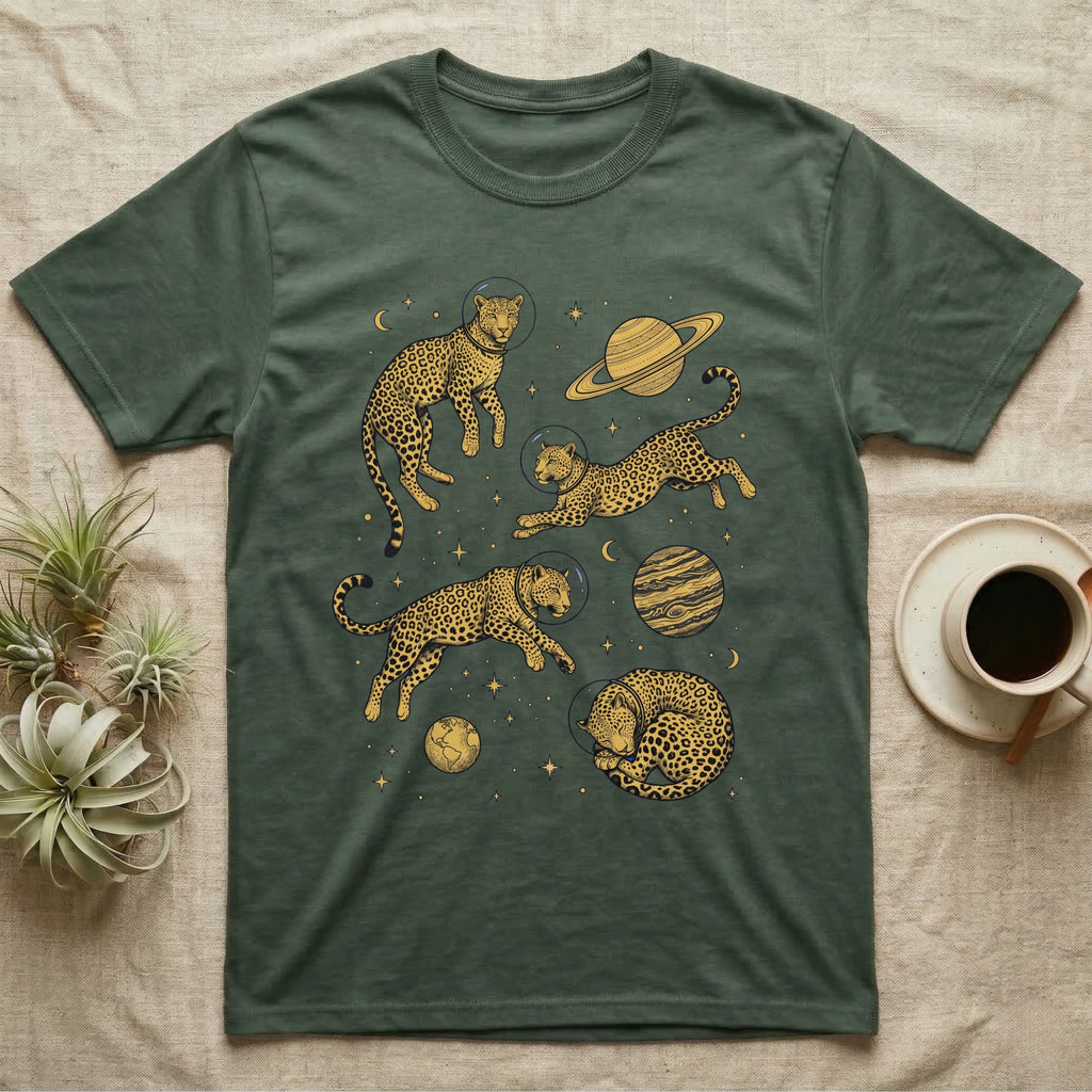 Green t-shirt with astronauts in space suits and planets.