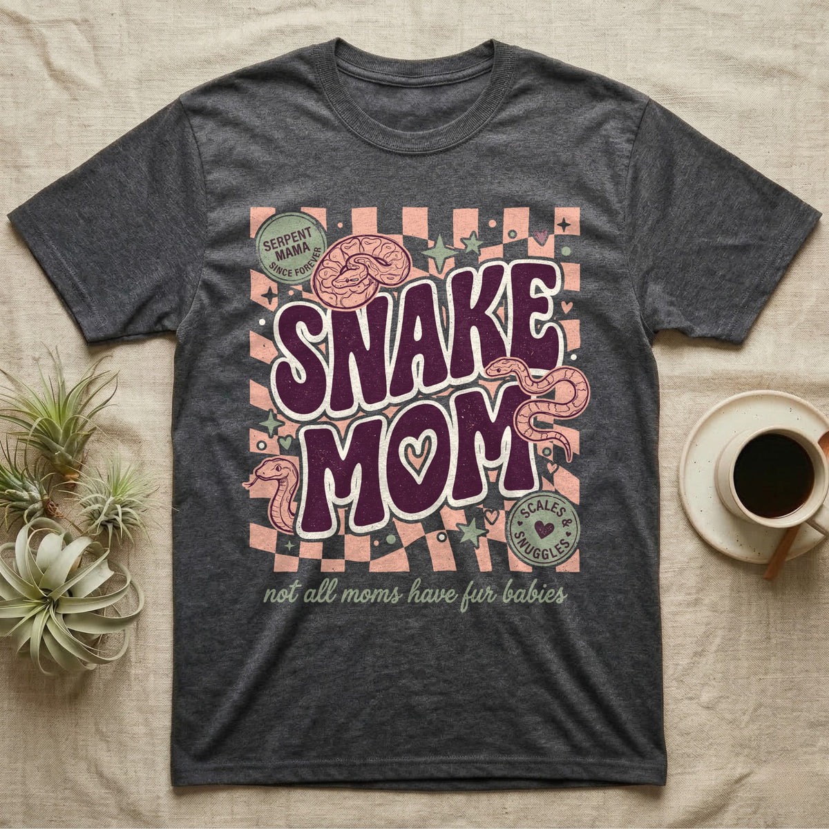 Dark gray t-shirt with "Snake Mom" graphic, snakes, and text.