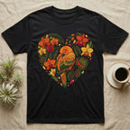 Black t-shirt with a heart-shaped design of a parrot and tropical flowers.