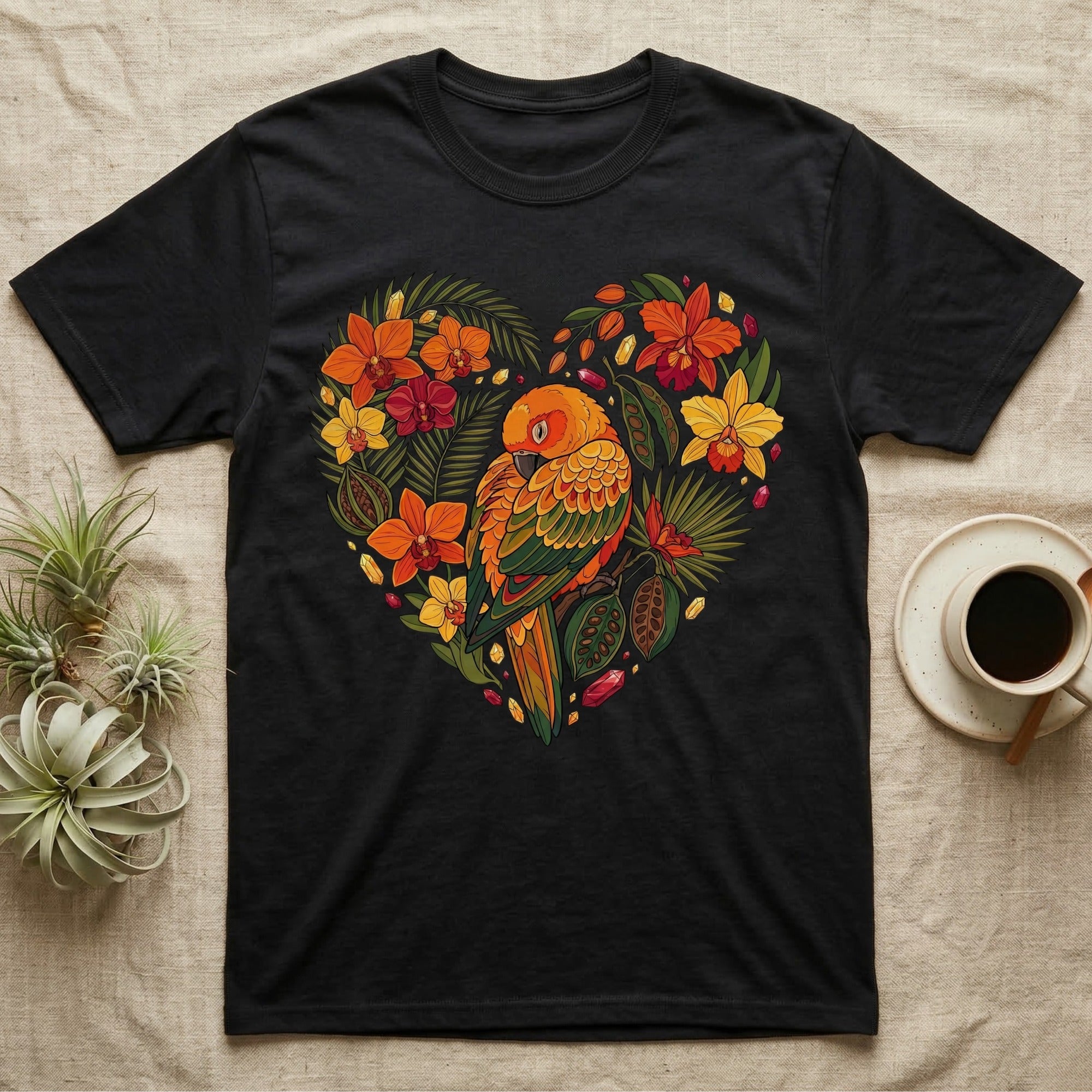 Black t-shirt with a heart-shaped design of a parrot and tropical flowers.