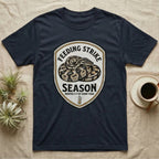 Ball Python Feeding Strike T-Shirt in Navy — Vintage-ink badge of a coiled ball python with carved type "Feeding Strike Season" and fine print "Months 3-7 Of Every Year."