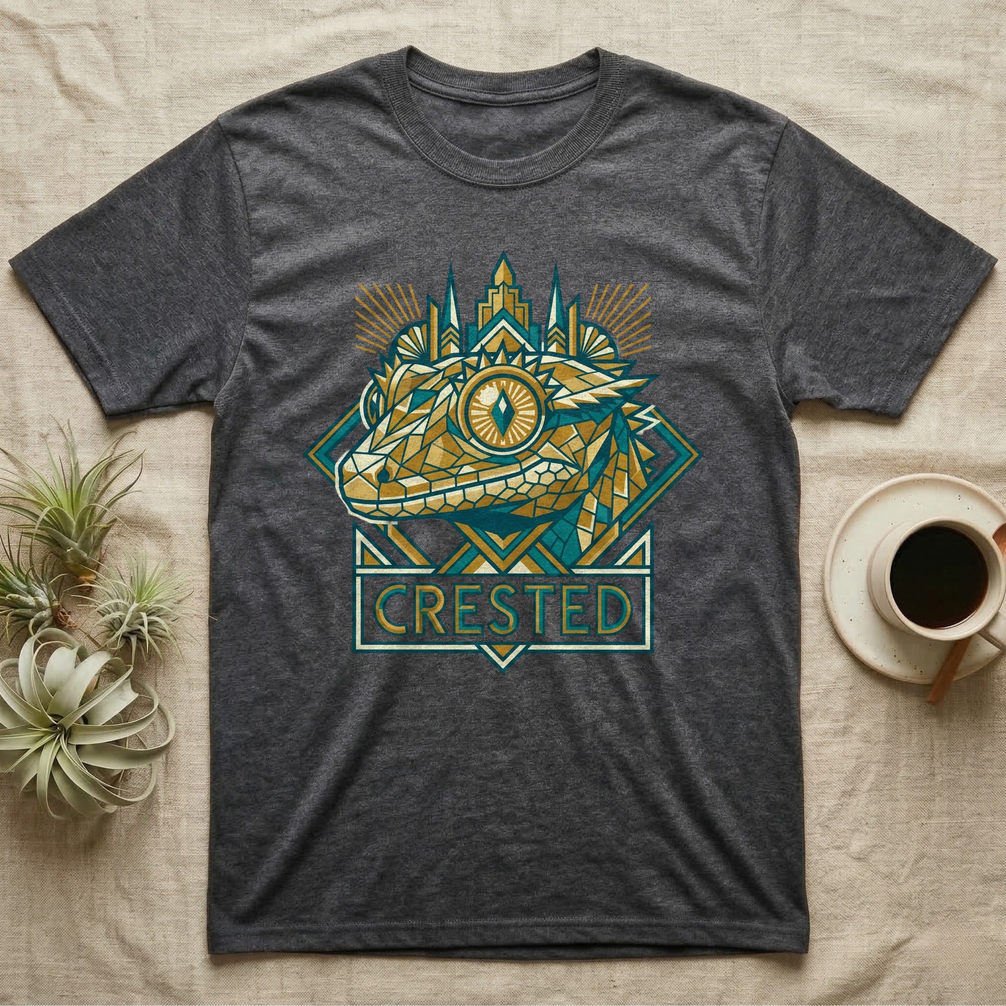 Dark gray t-shirt with a geometric gecko design and the word "CRESTED".