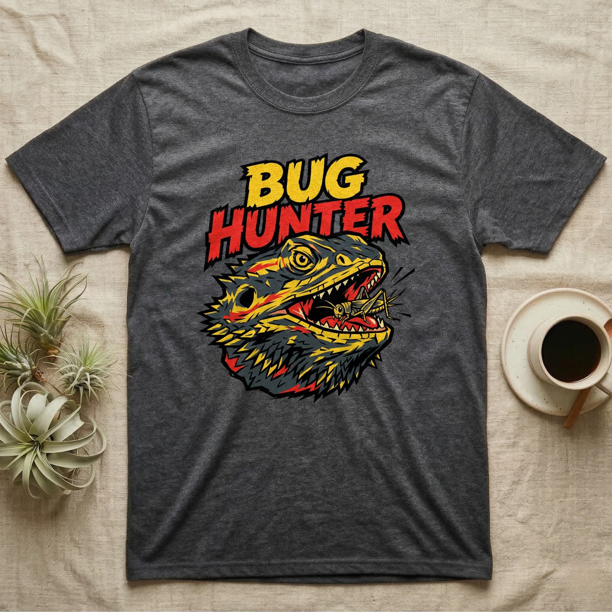 Dark gray t-shirt featuring a "Bug Hunter" graphic of a bearded dragon eating an insect.