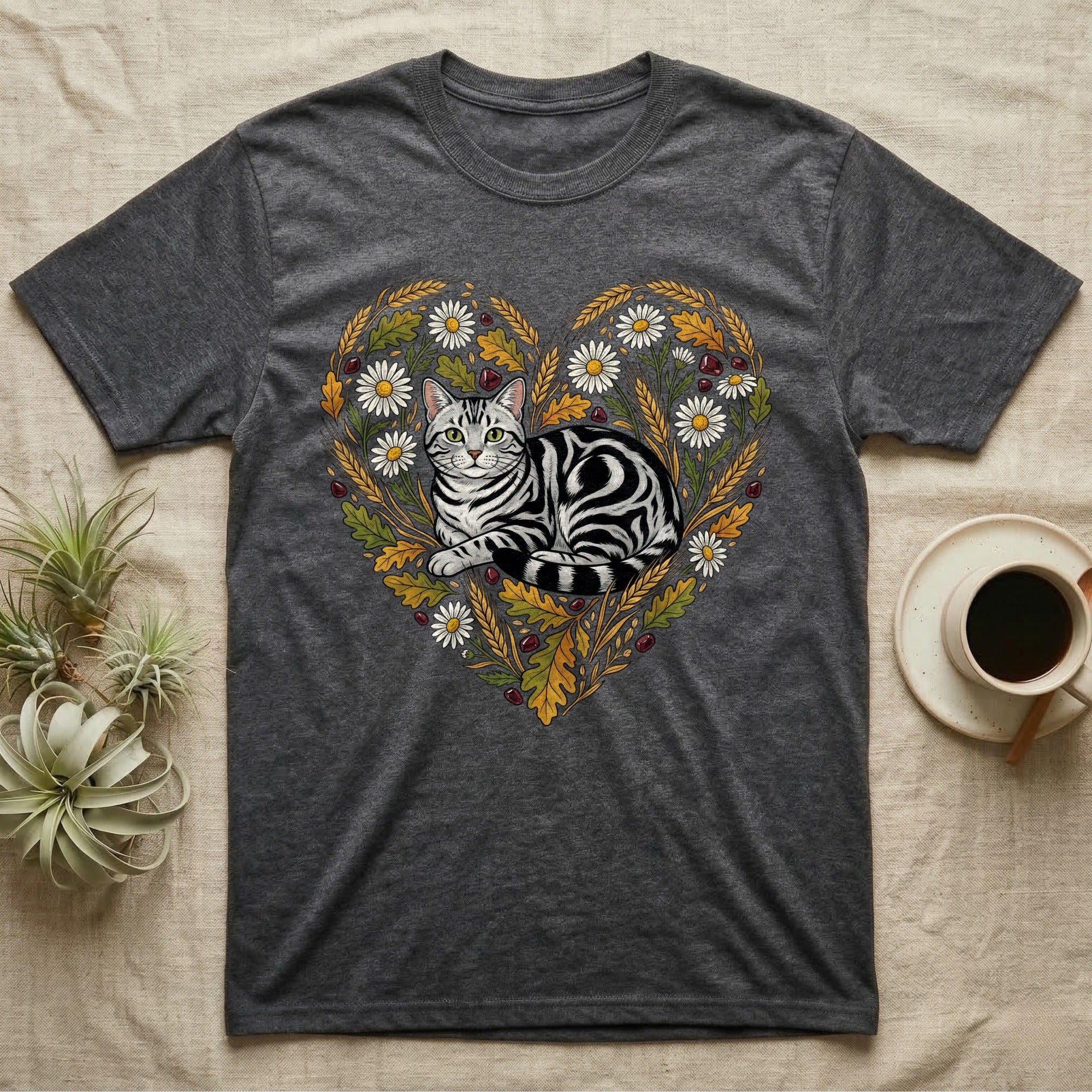 Dark grey t-shirt with a heart-shaped floral design featuring a tabby cat.