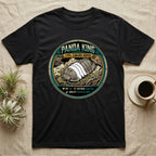 Panda King Isopod Trading Card T-Shirt in Black — Metal stat-card badge showing a Panda King Cubaris isopod on limestone with HP and ability lines.