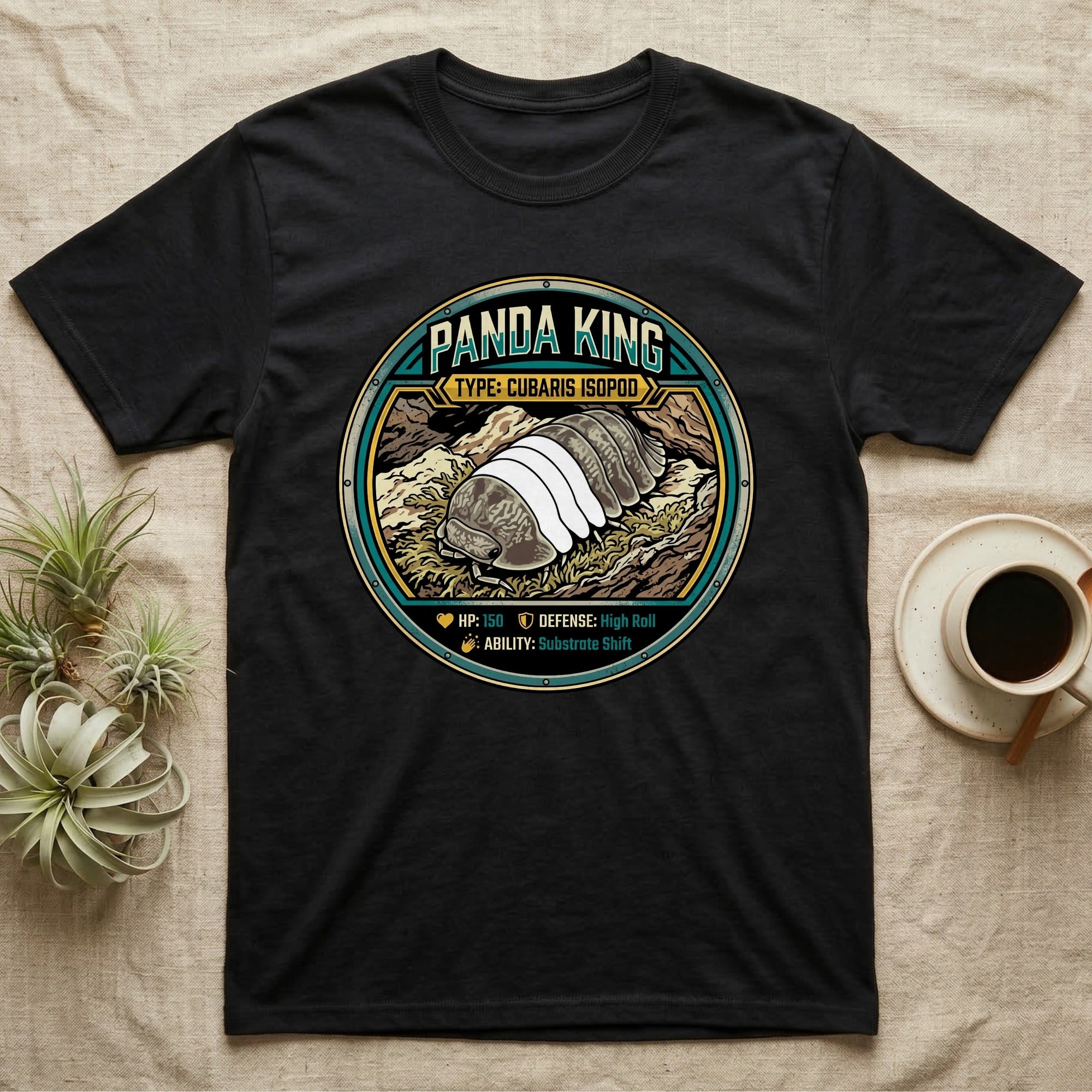Panda King Isopod Trading Card T-Shirt in Black — Metal stat-card badge showing a Panda King Cubaris isopod on limestone with HP and ability lines.