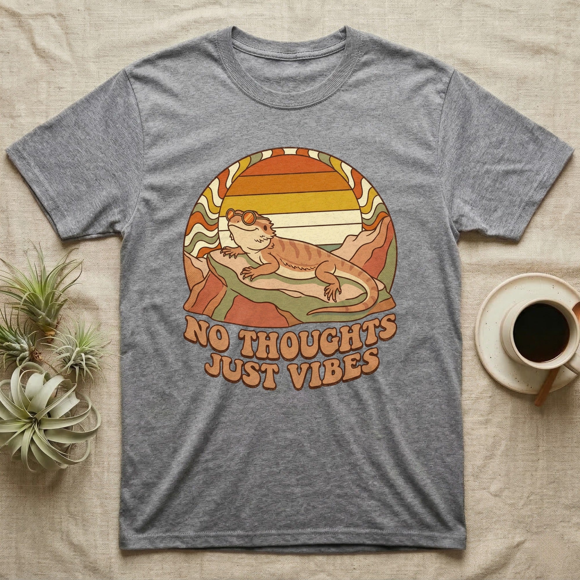 Gray t-shirt with a retro graphic of a bearded dragon and "NO THOUGHTS JUST VIBES" text.