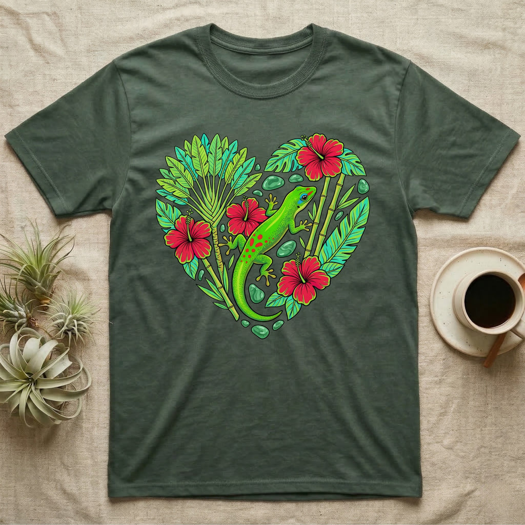 Green gecko on heart of tropical leaves and red hibiscus flowers.