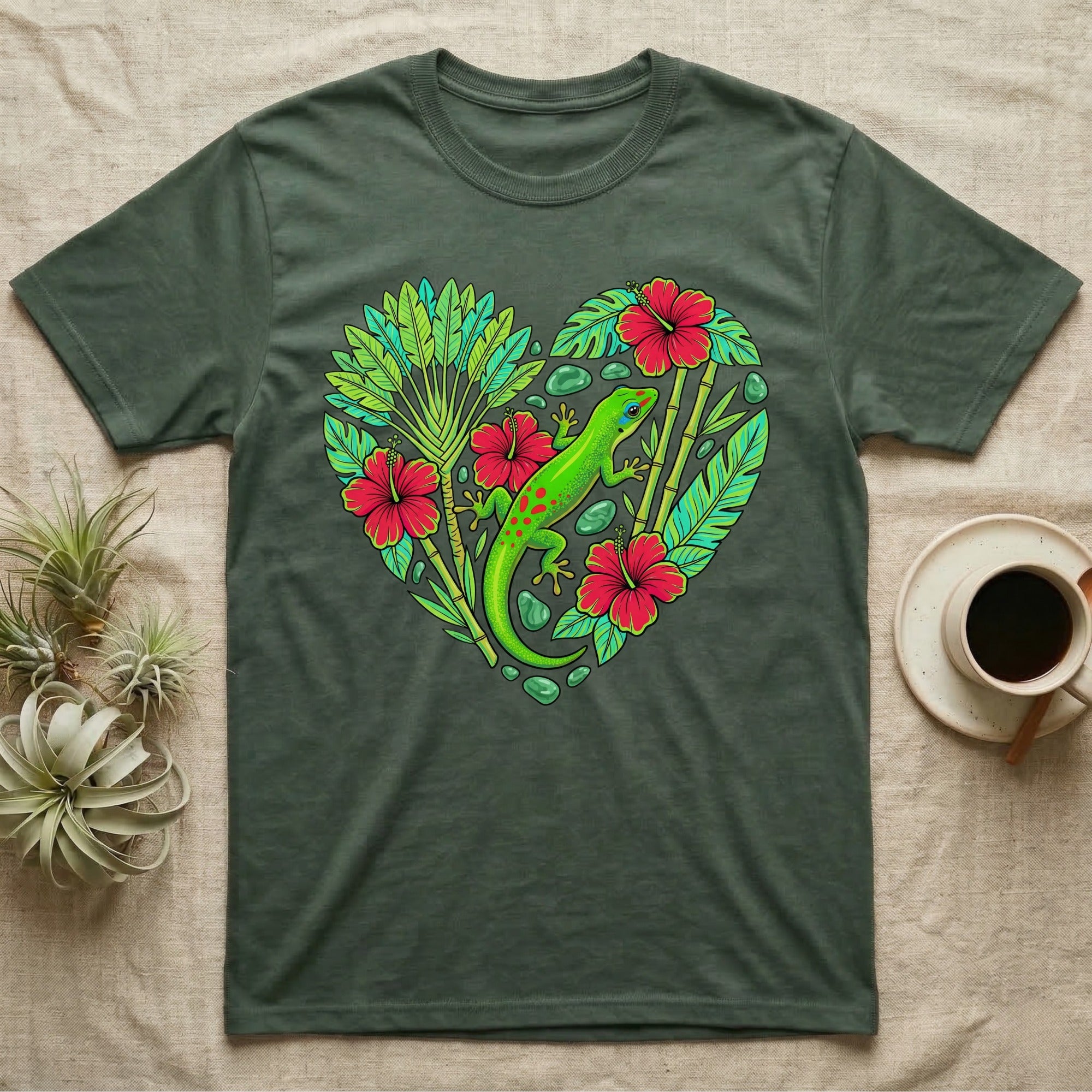 Green gecko on heart of tropical leaves and red hibiscus flowers.