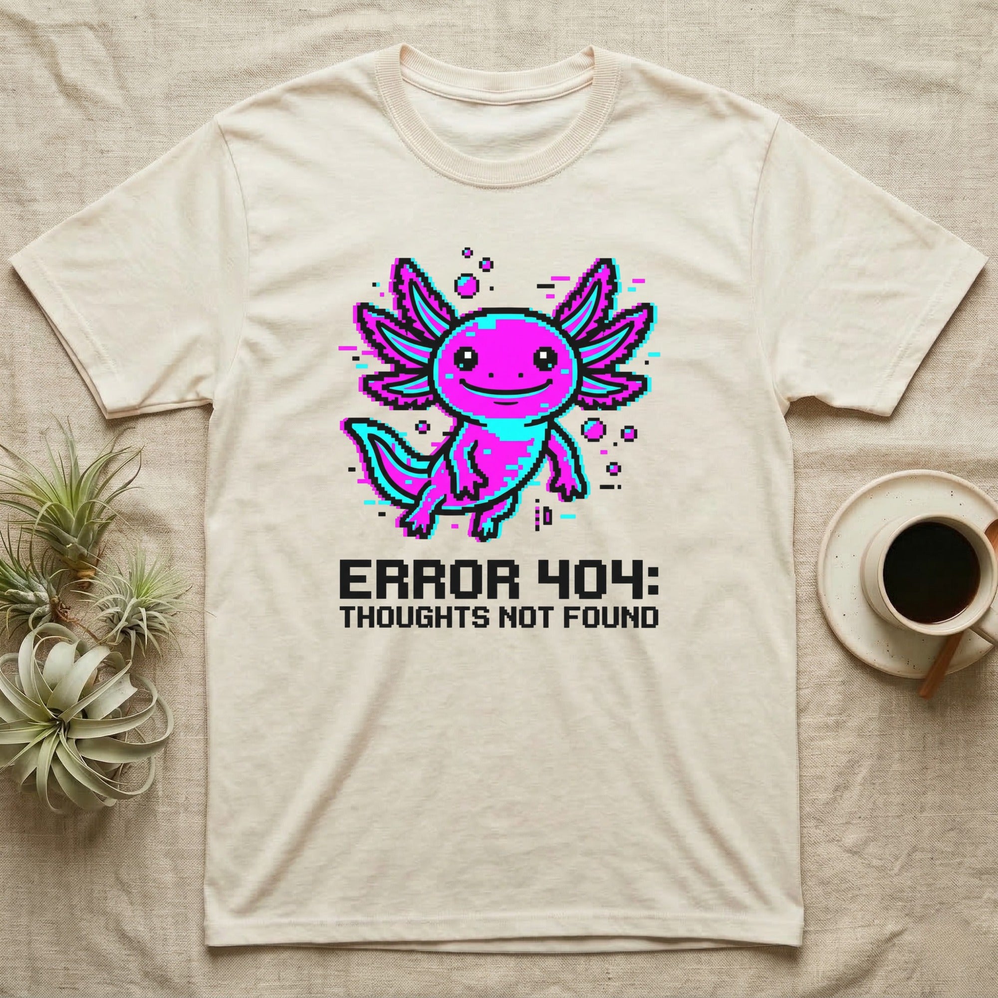 Pixelated axolotl with "ERROR 404: THOUGHTS NOT FOUND" text on a t-shirt.