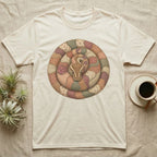 Cream t-shirt with a coiled snake design made of patchwork fabric.