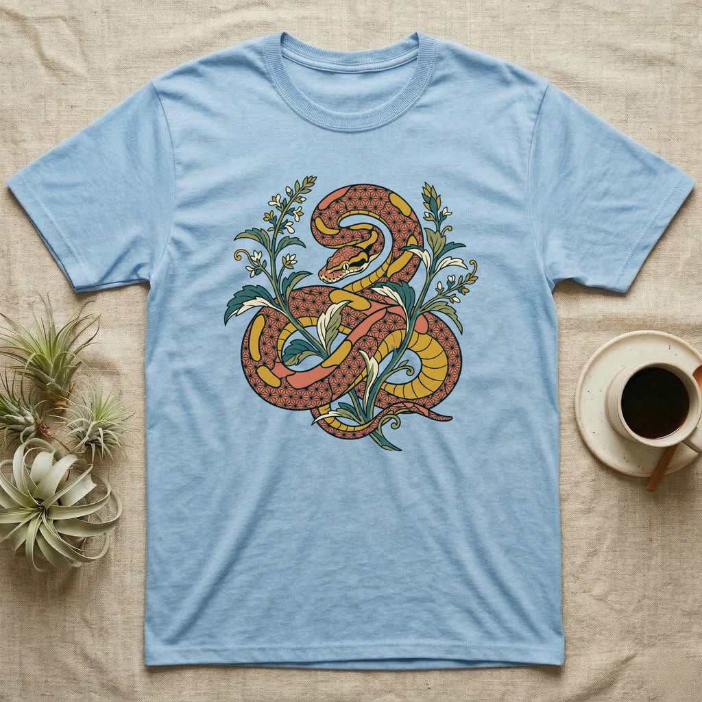 Light blue t-shirt with a coiled snake and floral design.